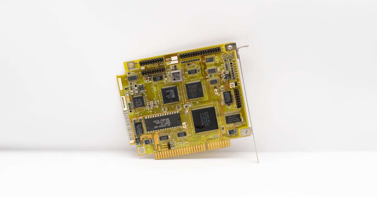 Antique circuit board showcasing vintage computing technology, isolated on a white background.
